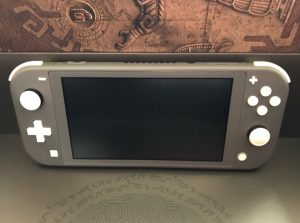 Nintendo Switch Lite and 2 games