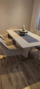 White, shiny dining table