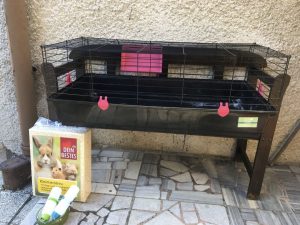 A cage for a rabbit or guinea pig