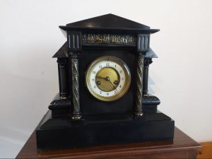 I am selling a functional Reinhold Schnekenburg fireplace clock