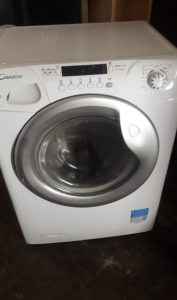 automatic washing machine with dryer Candy. from the wall 45 cm