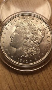 1921 Silver Morgan Dollar. Greenish, very nice piece.